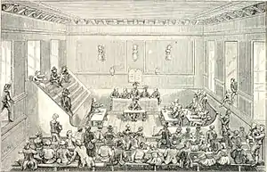 gravure en noir et blanc. La salle des séances du tribunal, avec au premier plan les tricoteuses