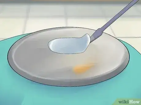 صورة عنوانها Remove a Security Tag from Clothing Step 10