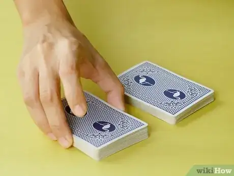 Image titled Riffle and Bridge Shuffle Step 2